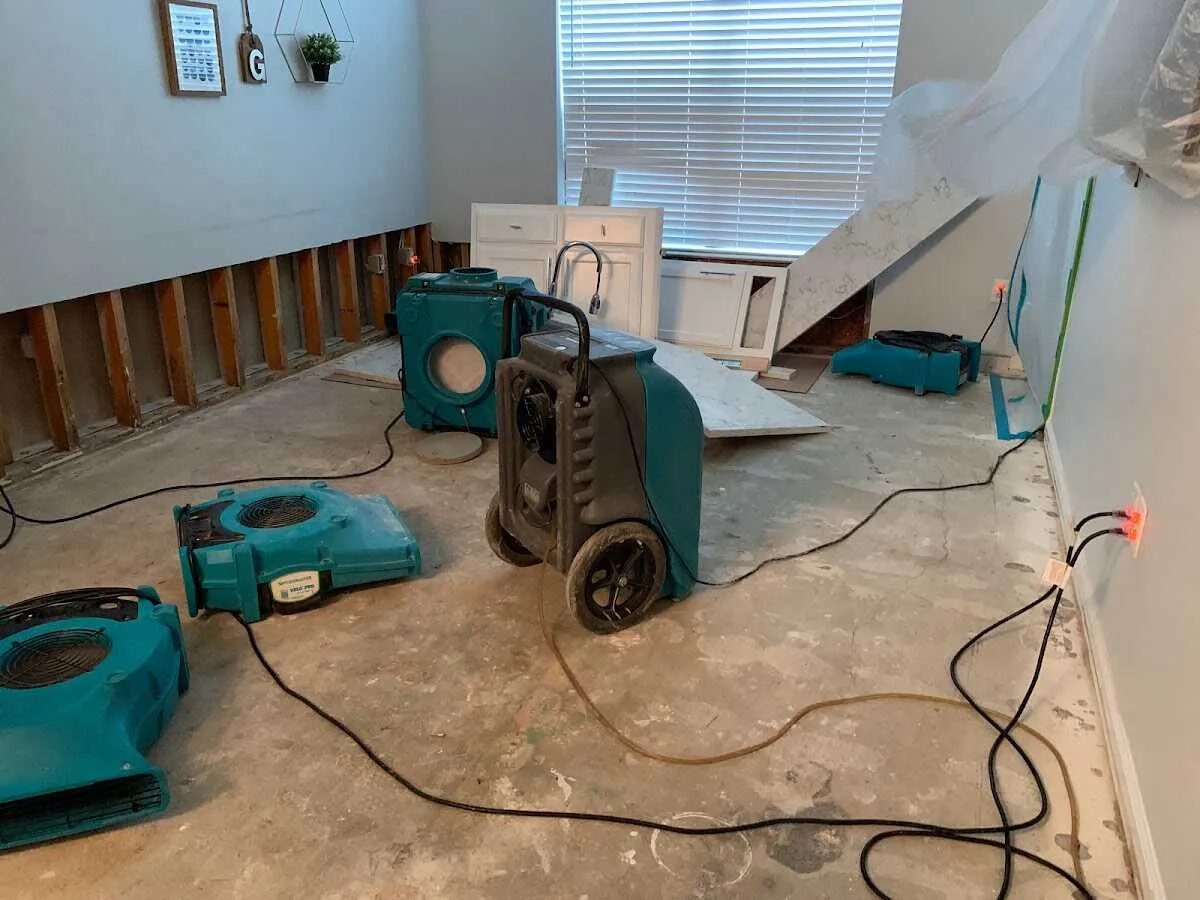 Dehumidifier in flood-cut room for Water Damage Restoration in Granby